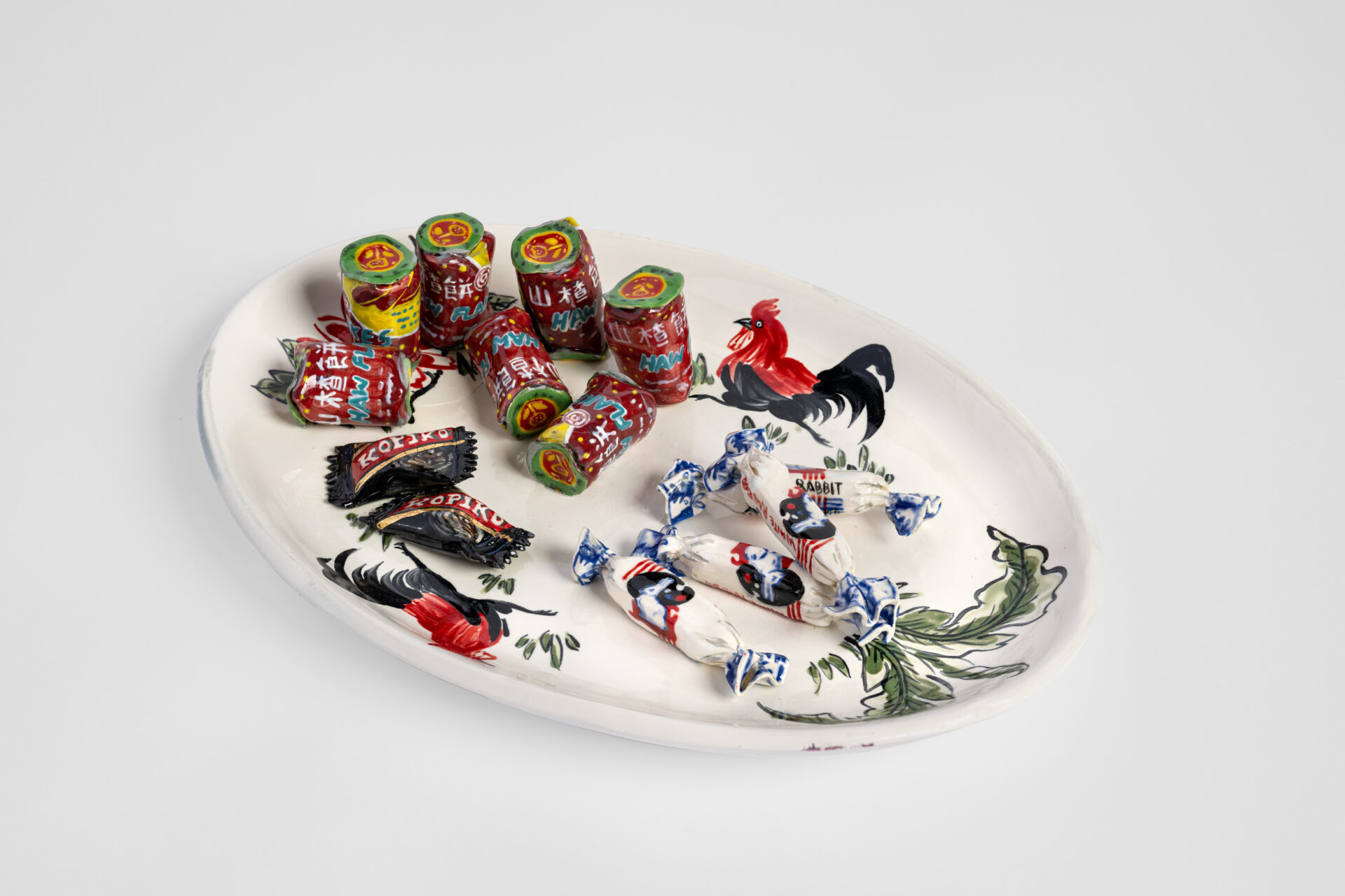 Rooster Plate with Haw Haw, Kopiko and White Rabbit Candy